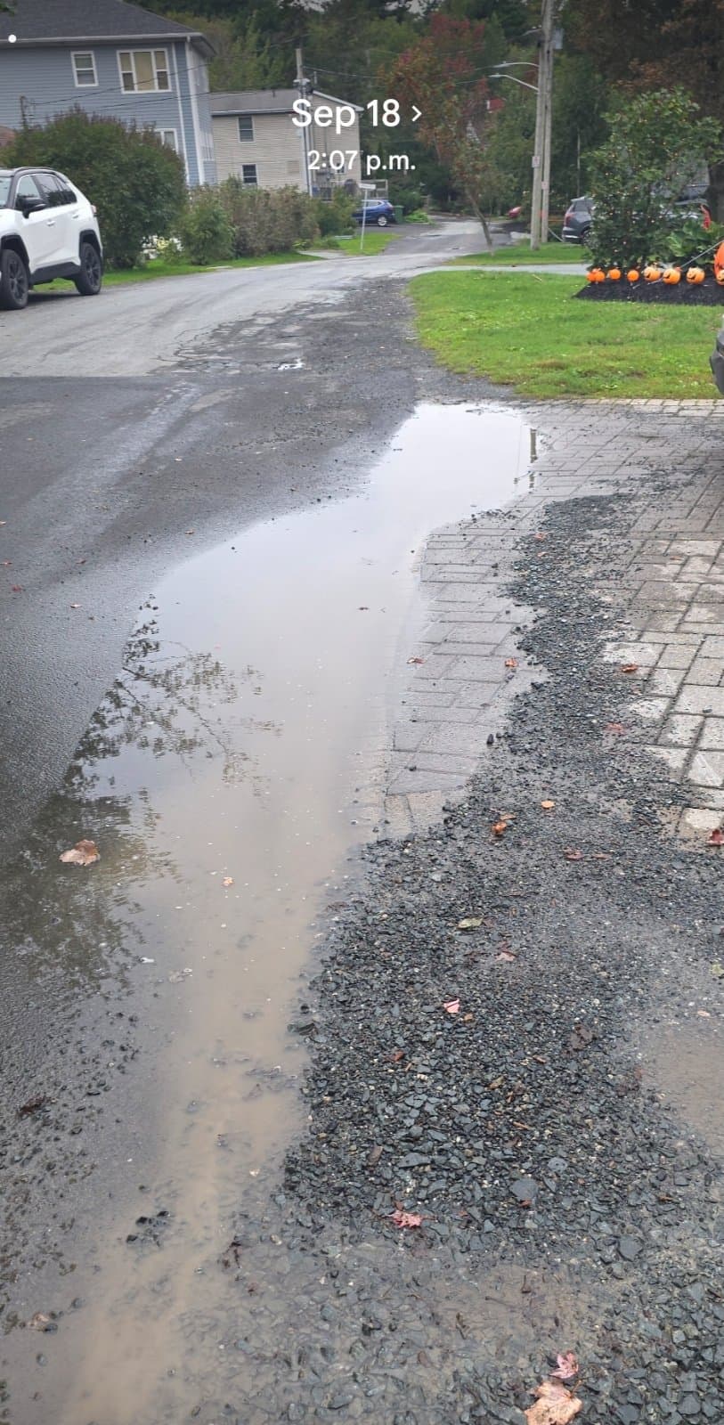 Street water running in driveway
